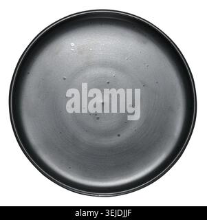 Empty black ceramic plate on isolated background Stock Photo