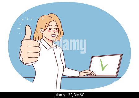 Smiling woman working on laptop showing thumb up Stock Photo