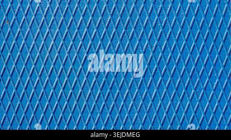 Blue iron wall with intersecting lines close up Stock Photo
