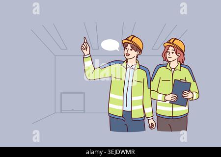 Two industrial room engineers discussing production process and how to repair equipment. Man and woman engineers in construction uniforms and safety h Stock Photo