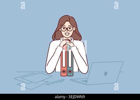 Business woman sits at table leaning on folders and smiling ejoicing at success in career as clerk Stock Photo