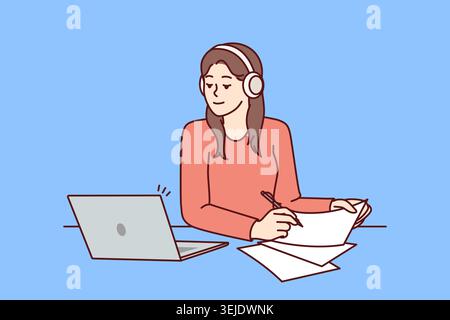 Woman with laptop sits at table and watches training webinar for gaining new skills Stock Photo