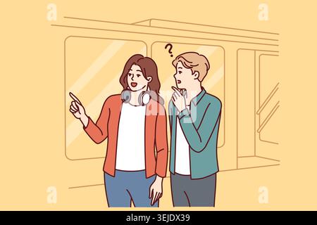 Man and woman tourists are standing near subway on tramway car, choosing shortest path Stock Photo