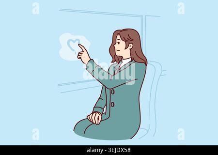 Woman passenger of tram draws heart on glass, remembering beloved man and wishing to meet Stock Photo