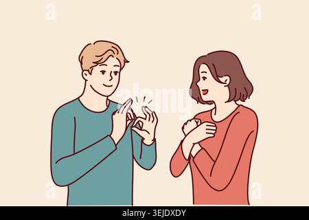 Deaf-mute man and woman are talking using sign language and demonstrating symbols with hands Stock Photo