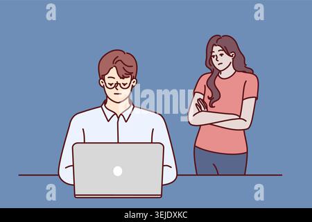 Frustrated woman near husband using laptop and suffering from internet addiction Stock Photo