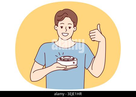 Man with smoke detector gives thumbs up recommending purchase of fire safety equipment Stock Photo
