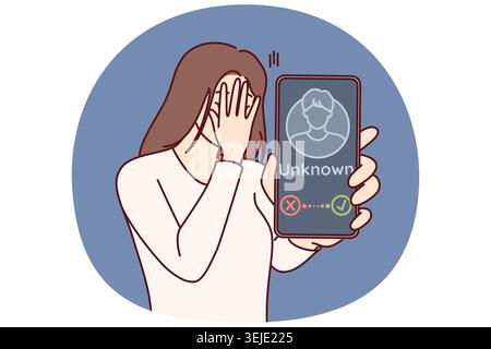 Woman receives phone call from anonymous stalker and shows smartphone screen covering face with hand Stock Photo