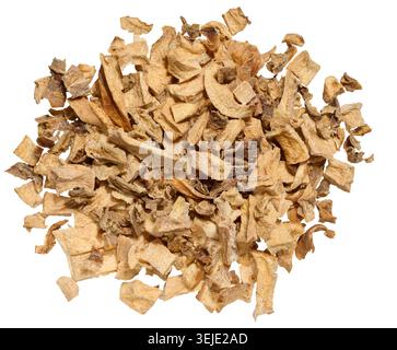 A close-up of dried vegetable pieces, including onion, beetroot, and carrot on isolated background. The mix for soups and season Stock Photo