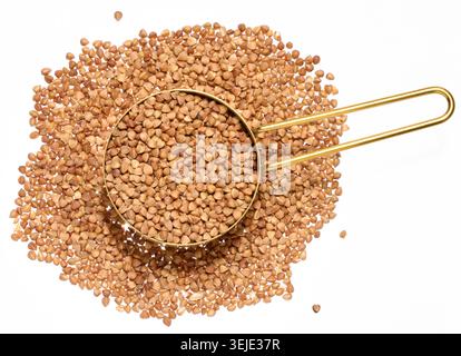 Raw buckwheat grains on isolated background, close up Stock Photo