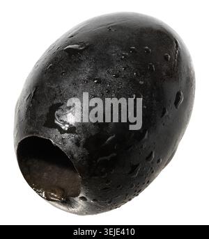 Single, smooth, pitted black olive with water droplets on its surface,  isolated background. Stock Photo