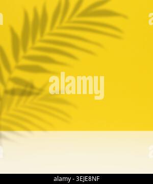 Soft, blurred shadows of palm leaves are cast across a solid light yellow background Stock Photo