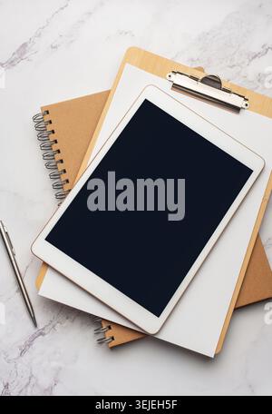 Tablet pc  and notebooks  on the office desk Stock Photo