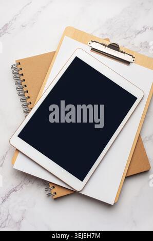 Tablet pc  and notebooks  on the office desk Stock Photo