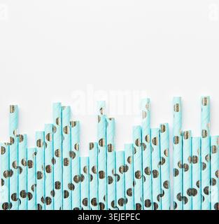 Drinking dotted straws for party  on white  background with copy space. Top view of colorful paper disposable eco-friendly straw Stock Photo