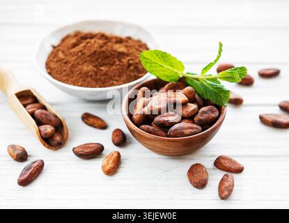 Bowl with Cocoa powder and beans Stock Photo