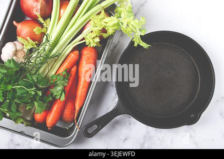 Cast-iron frying pan, baking tray with vegetables, for cooking ossobuco, top view, no people, Stock Photo
