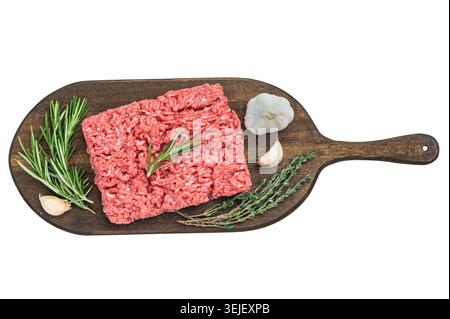 Fresh raw groundmeat with rosemary and thyme on dark wooden board against white background ideal for cooking, butcher and protein themes Stock Photo