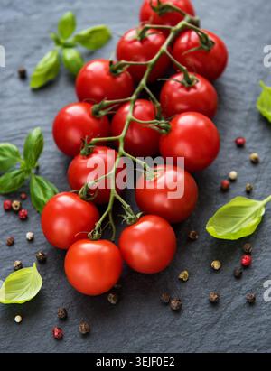 Cherry tomatoes on a black Stock Photo