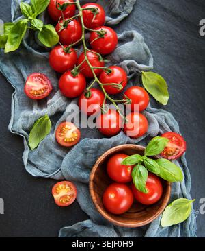 Cherry tomatoes on a black Stock Photo