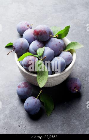 Garden plums in bowl Stock Photo