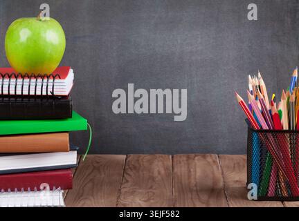 School and office supplies on classroom table Stock Photo