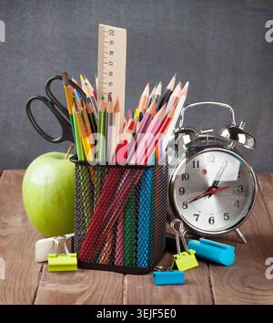 School and office supplies on classroom table Stock Photo