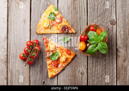 Pizza with tomatoes, mozzarella and basil Stock Photo
