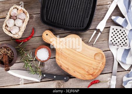 Cooking utensils and spices on wooden table Stock Photo