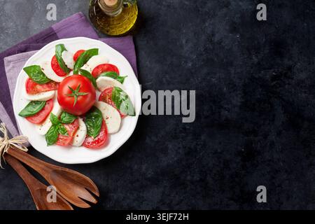 Caprese salad. Mozzarella, tomatoes and basil Stock Photo
