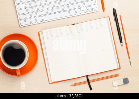 Office desk table with computer, supplies and coffee cup Stock Photo