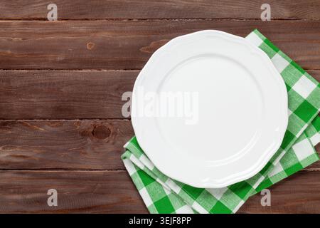 Empty plate over wooden table Stock Photo