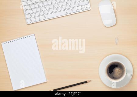 Office table with notepad, computer and coffee cup Stock Photo