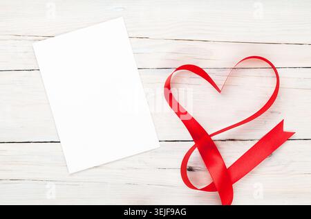 Photo frame or gift card with valentines heart shaped ribbon Stock Photo