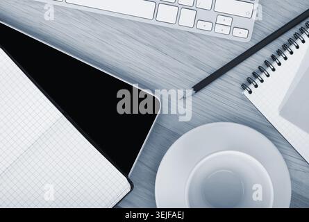 Office supplies, gadgets and coffee cup Stock Photo