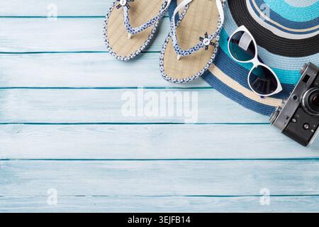 Beach accessories. Flip flops, camera, hat and sunglasses Stock Photo