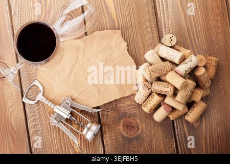 Wine glasses, corks, corkscrew and piece of paper Stock Photo