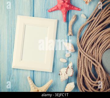 Sea vacation with blank photo frame, star fish and marine rope Stock Photo