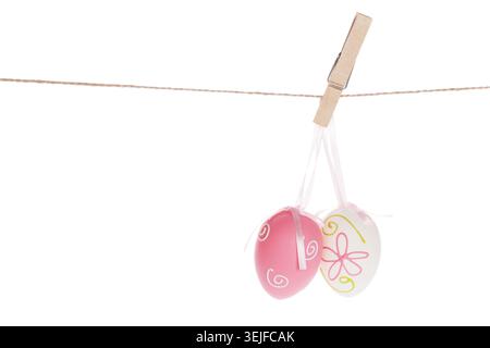 Colorful easter eggs hanging on rope Stock Photo