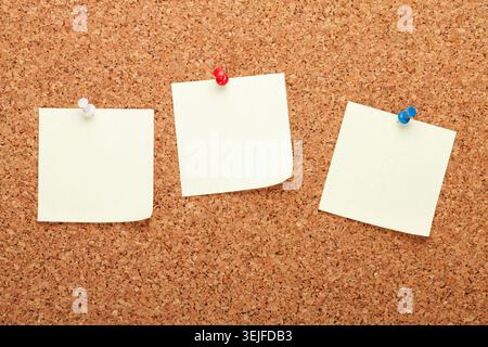 Blank notes on cork notice board Stock Photo