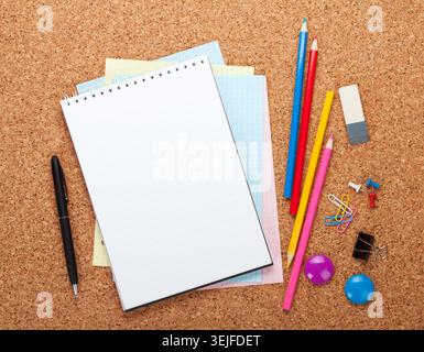 Blank notepad on cork notice board Stock Photo
