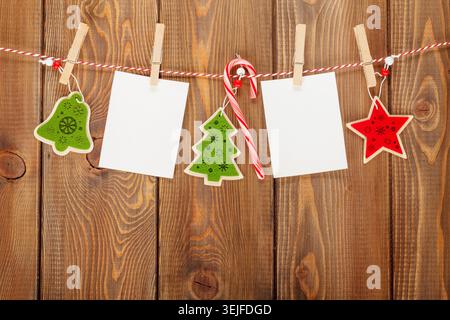 Photo frames and christmas decor on rope Stock Photo
