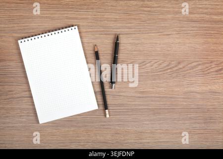 Blank notepad with pen and pencil Stock Photo
