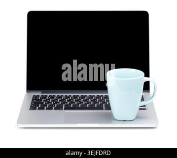 Tea cup on laptop Stock Photo