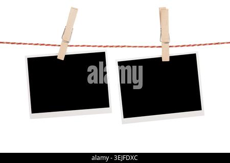 Blank photos hanging on clothesline Stock Photo