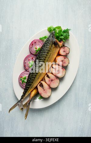 Smoked mackerel, top view, with spices, on a wooden table, no people, selective focus, Stock Photo
