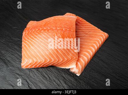 Fresh Salmon Fillet, Raw Norwegian Red Fish, Trout Meat Piece, Fresh Atlantic Salmon Fillet on Black Stone Background Stock Photo