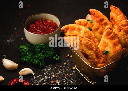 Fried mini pasties, with red sauce, top view, close-up, no people, selective focus, Stock Photo