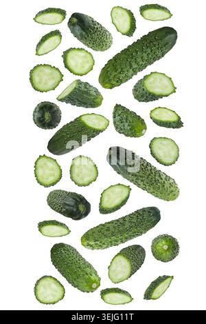 Crisp small young green cucumber whole, cut fly or fall as wide stripe flow, isolated. Fresh natural organic summer food as desi Stock Photo