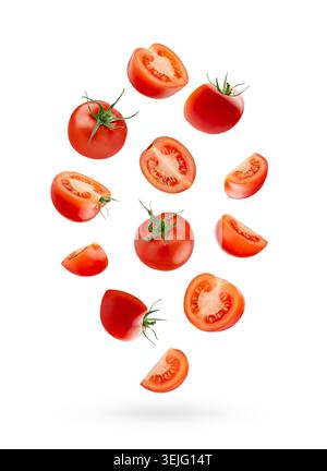 Bright red cherry tomatoes - whole, sliced levitation as swirl in art composition, isolated white background. Vegetarian diet fo Stock Photo